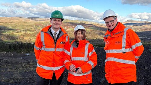 David Chadwick MP & Jane Dodds MS standing in front of a disused coal mine at the Global Centre for Rail Excellence site