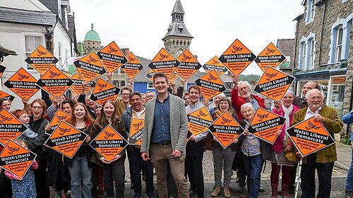 David Chadwick surrounded by Lib Dem supporters